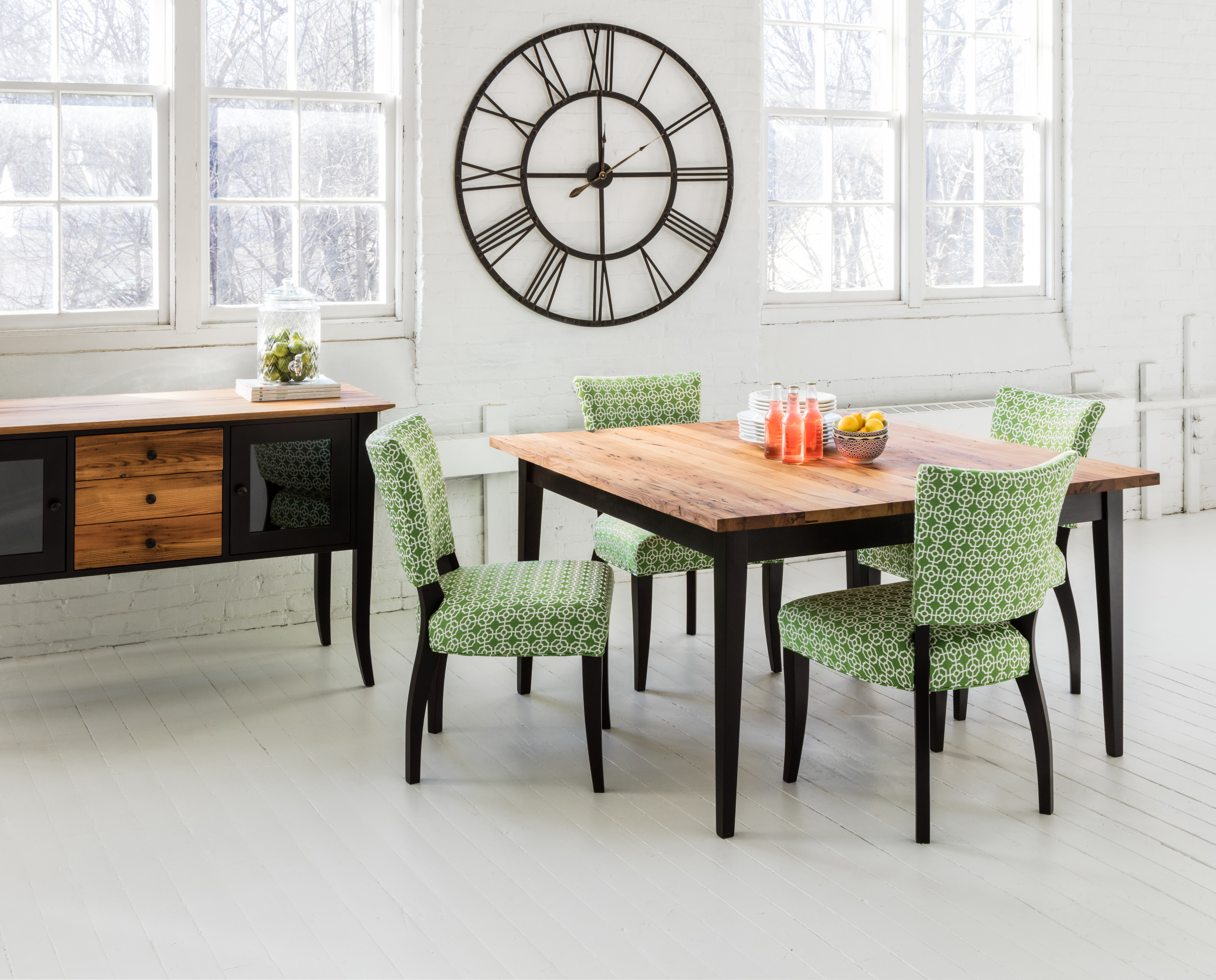 dining room with small wooden table and four upholstered chairs