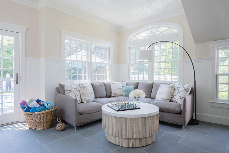 open living room with high ceiling and tile floor