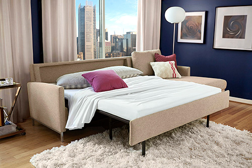 Comfort Sleeper Sofa in bed mode made up for guests